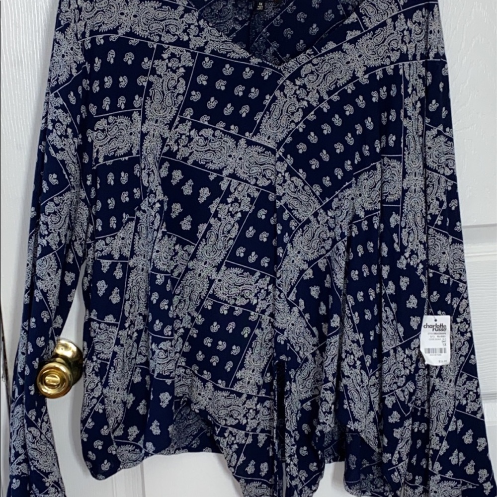 Blue blouse with design.